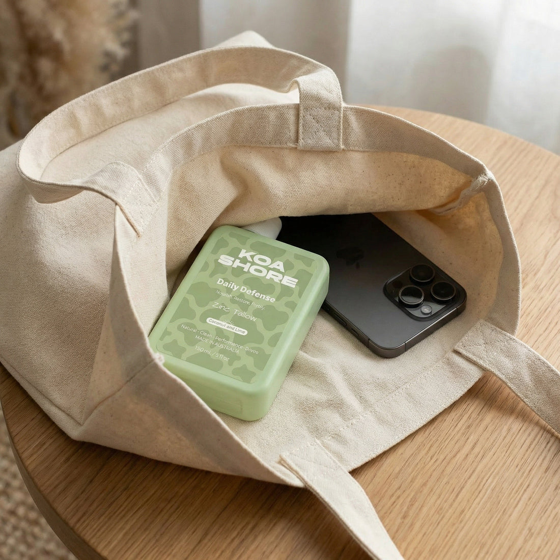 Koa Shore Daily Defence bottle in bag — skincare for outdoor men